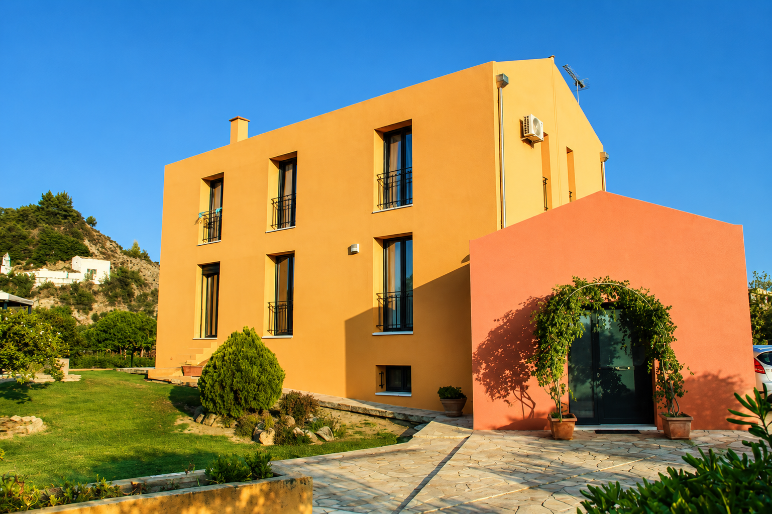 Casa Spannika exterior with colourful Mediterranean walls